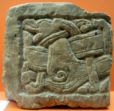 Viking tombstone from York, which shows an animal that fights against a snake