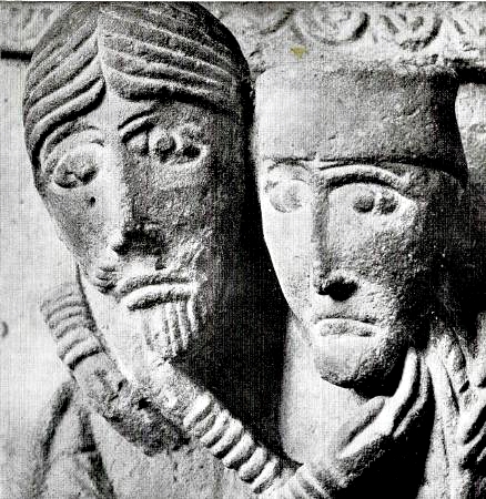 Man and woman with their arms around each other on baptismal font in Tryde Church