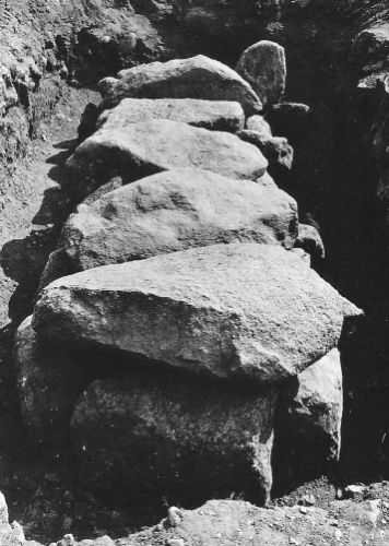 Excavated flat stone chest before the cover stones were removed