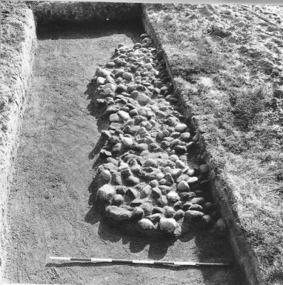 Stone heap graves under excavation