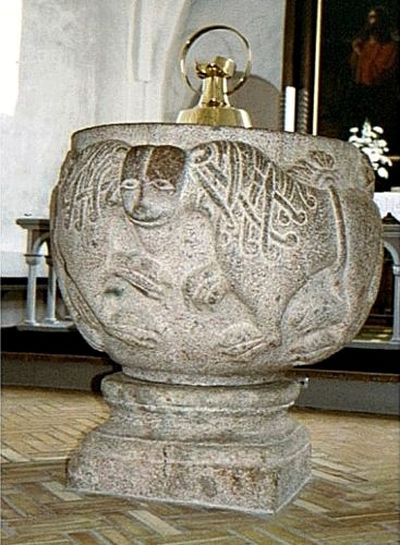 Romanesque granite baptismal font in Nørre Snede Church