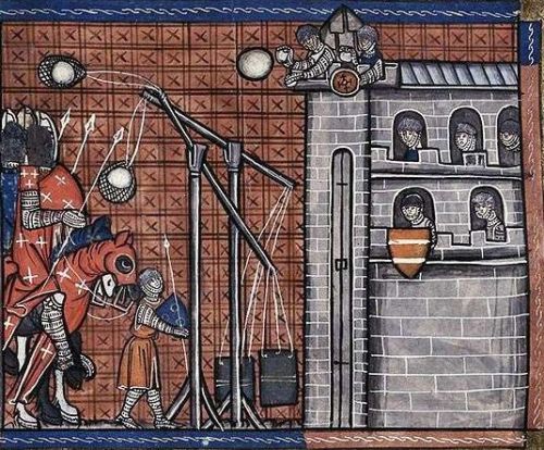 Siege of fortress in 1300's illustration. Stones are thrown at a castle with a throwing machine