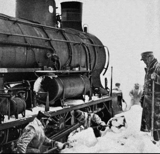 A locomotive is 
dug free of snow on the Roskilde railway - Denmark - in winter 1942