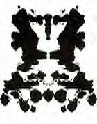 An inkblot reminiscent of two seahorses kissing each other