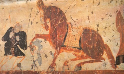 A blond steppe warrior displays his trained horse - cave painting from Dunhuang